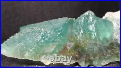 Green Fluorite Coupled with Quartz Crystals, Frosted over Rock